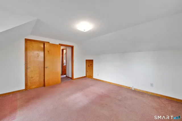 an empty room with closet area