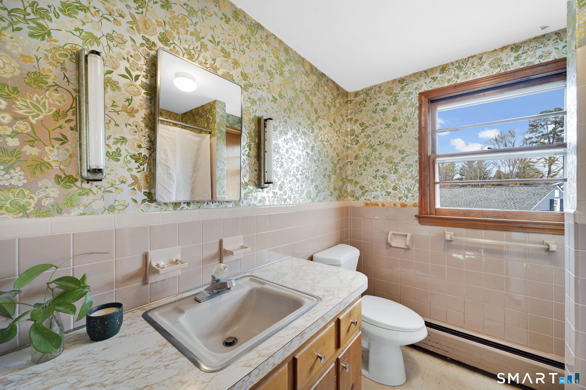 10 Helena Lane Windsor Locks, CT 06096 - Photo 22 of 36 a bathroom with a sink mirror toilet and next to a window