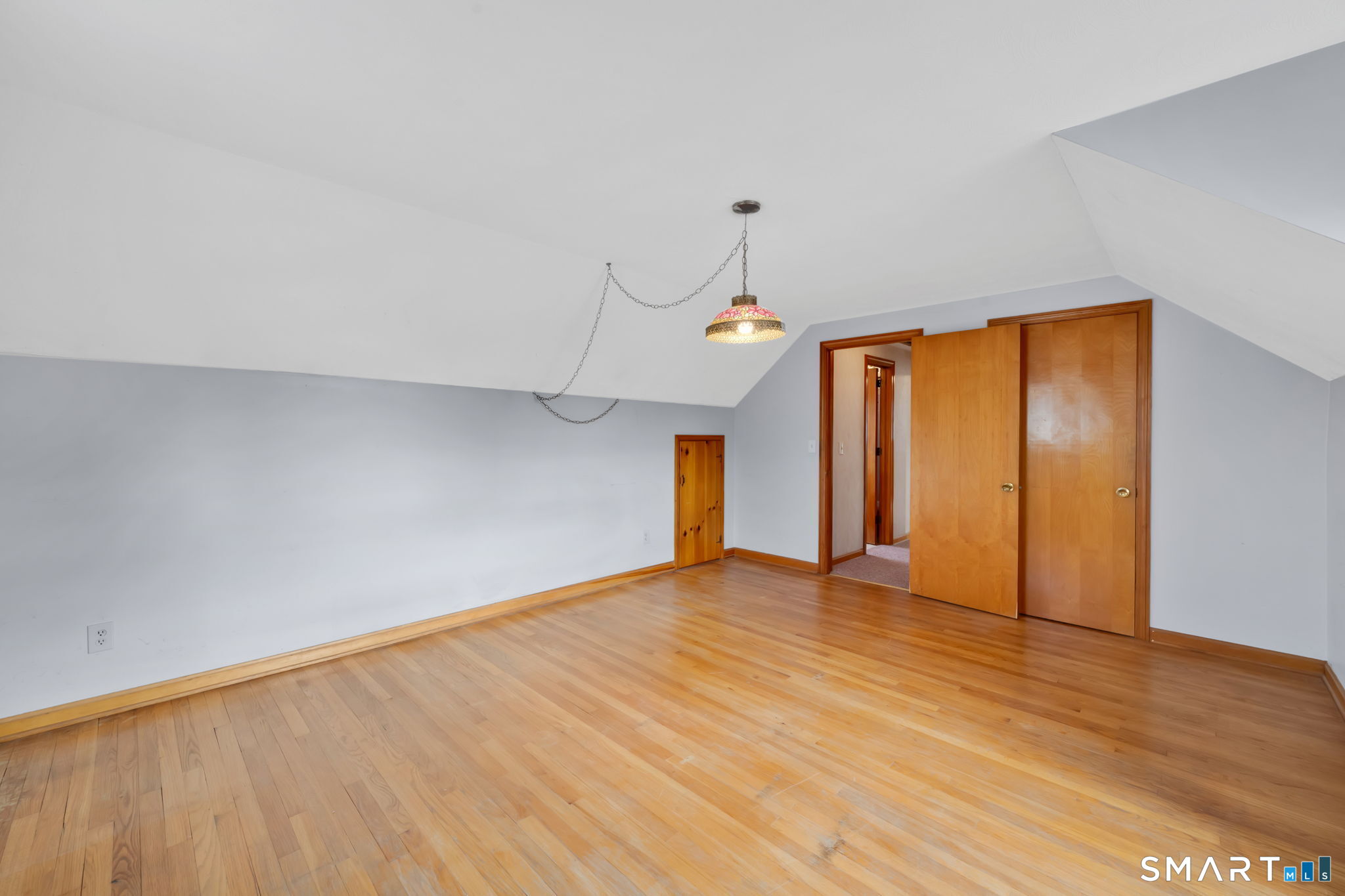10 Helena Lane Windsor Locks, CT 06096 - Photo 25 of 36 a view of an empty room with wooden floor and a window