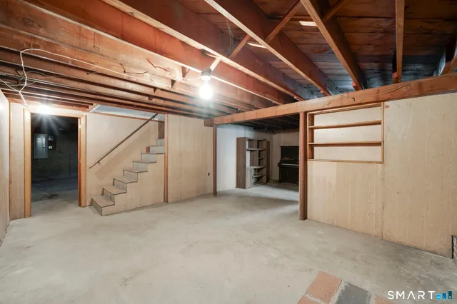 a view of an empty room with closet