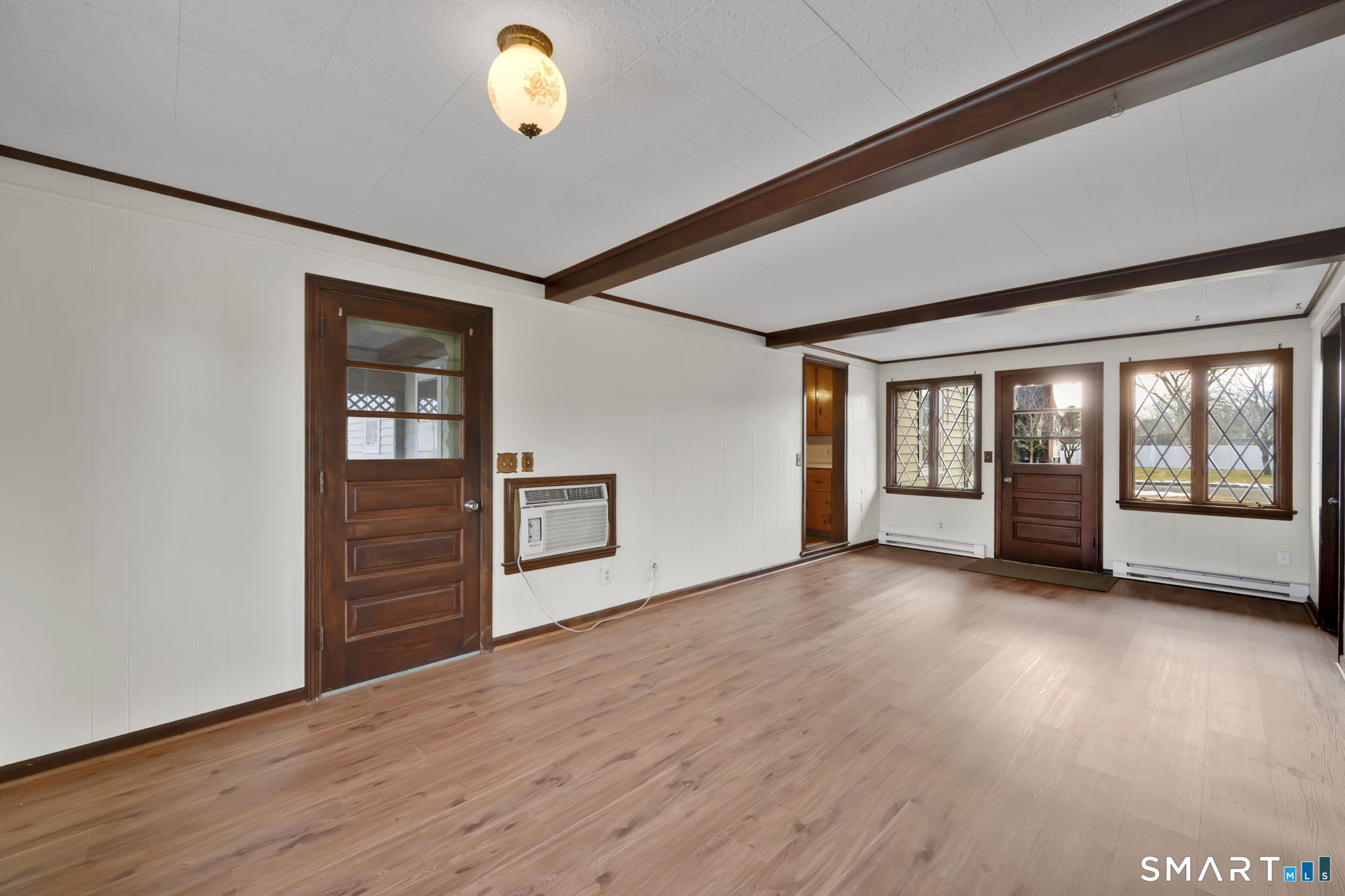 10 Helena Lane Windsor Locks, CT 06096 - Photo 3 of 36 wooden floor in an empty room with a window