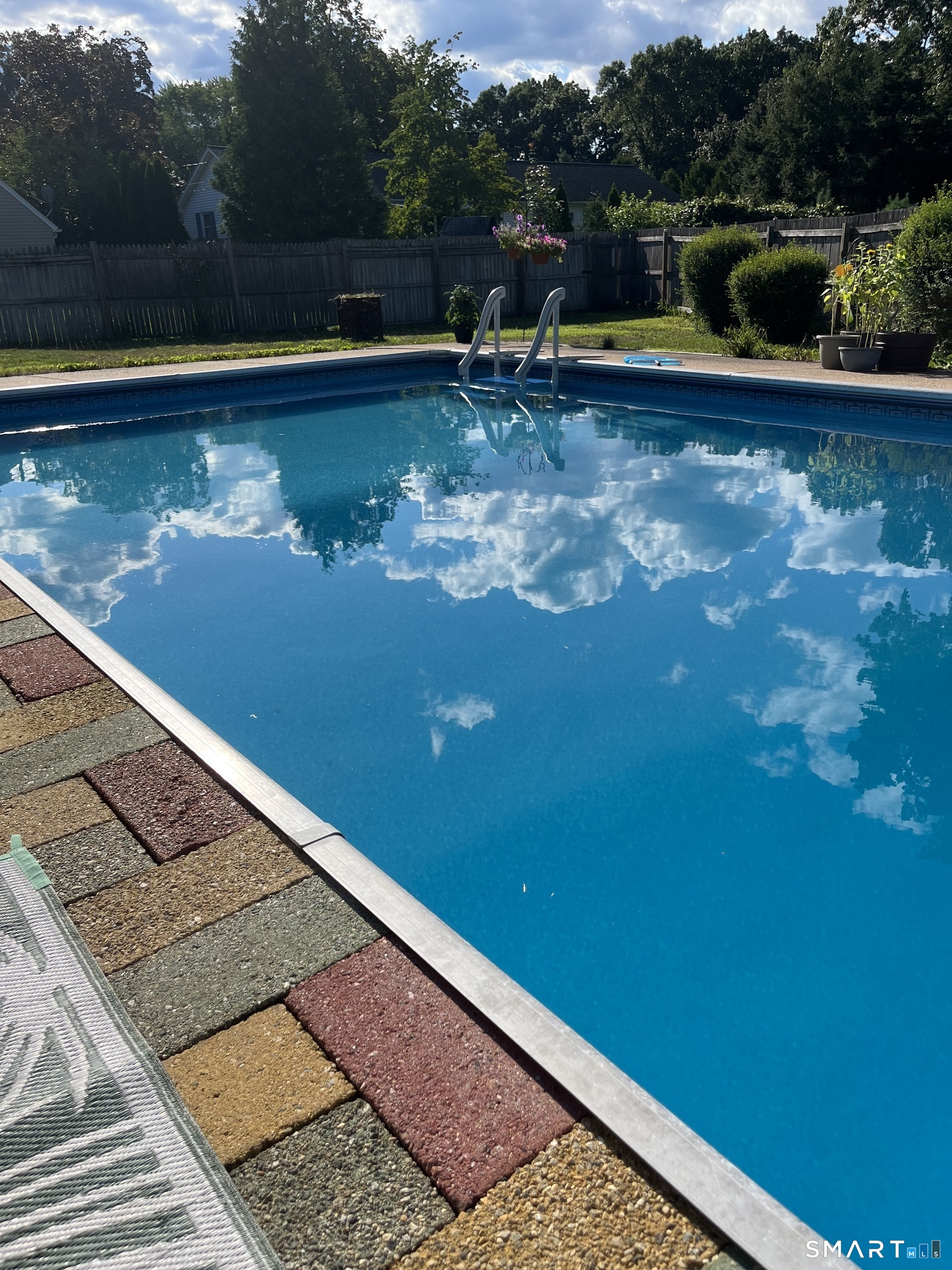 10 Helena Lane Windsor Locks, CT 06096 - Photo 32 of 36 a view of a lake with a bench