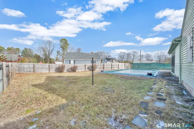 a view of backyard with green space