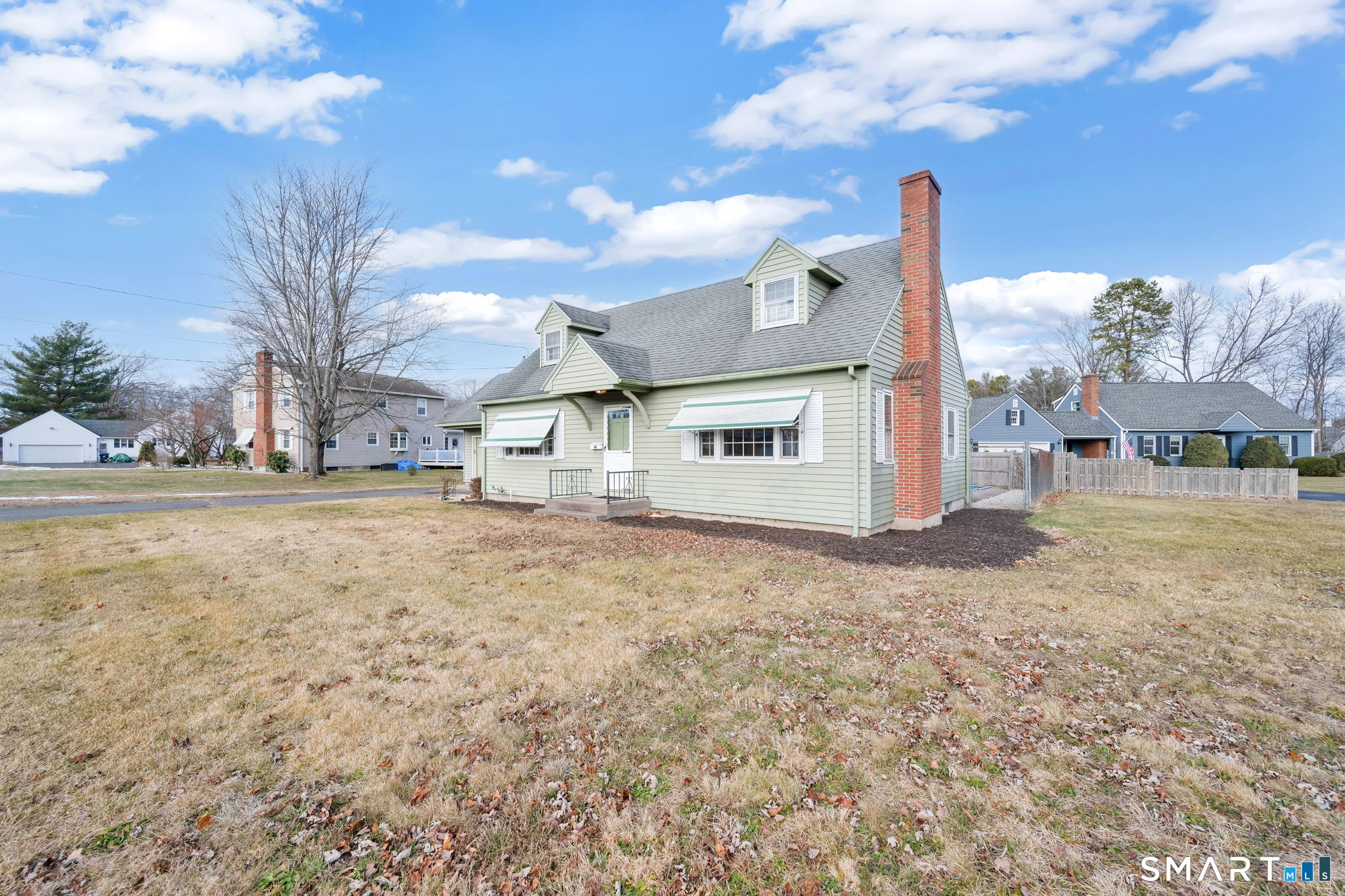 10 Helena Lane Windsor Locks, CT 06096 - Photo 35 of 36 a view of a house with backyard and a tree
