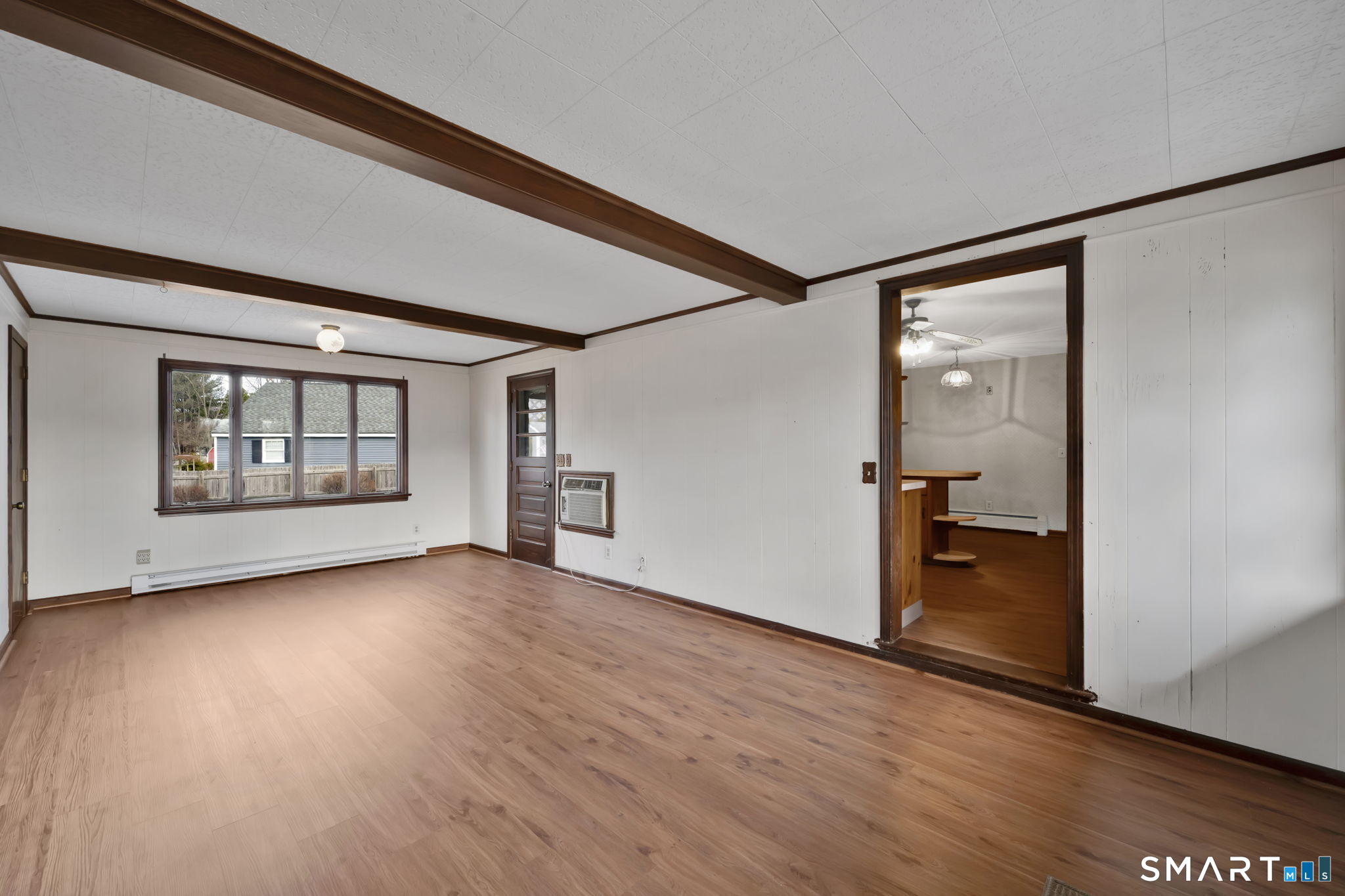 10 Helena Lane Windsor Locks, CT 06096 - Photo 5 of 36 a view of an empty room with wooden floor and a window
