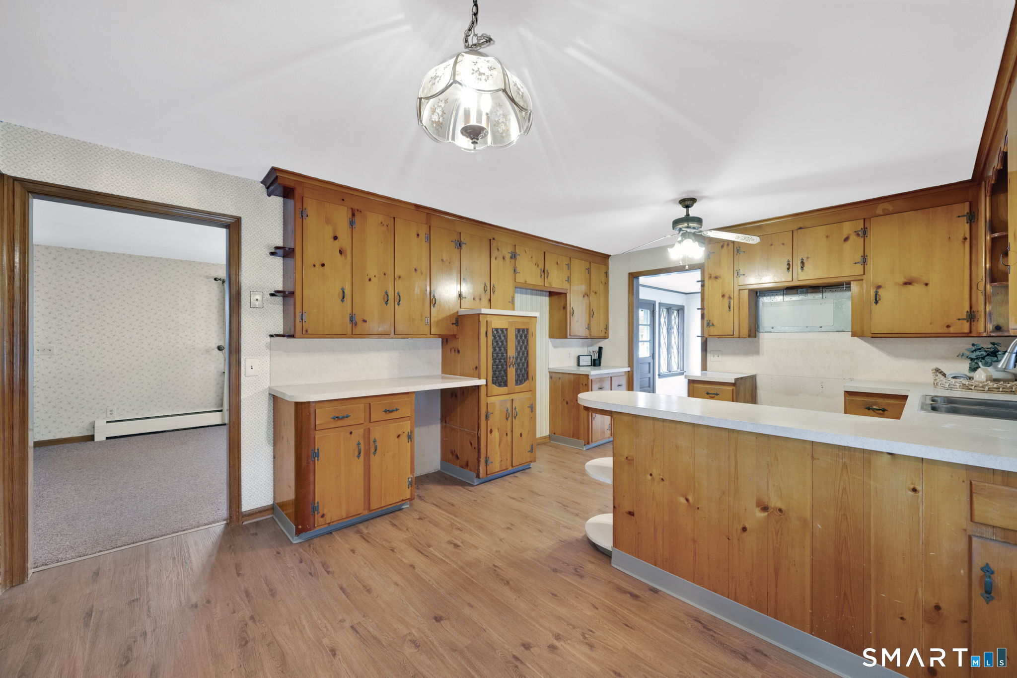 10 Helena Lane Windsor Locks, CT 06096 - Photo 6 of 36 a kitchen with stainless steel appliances a sink cabinets and wooden floor