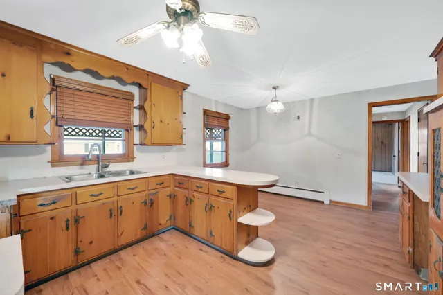 a spacious bathroom with sinks and a mirror