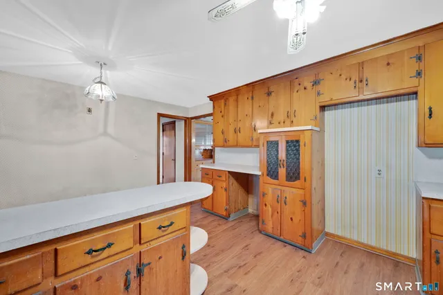 a kitchen with stainless steel appliances granite countertop a sink and cabinets