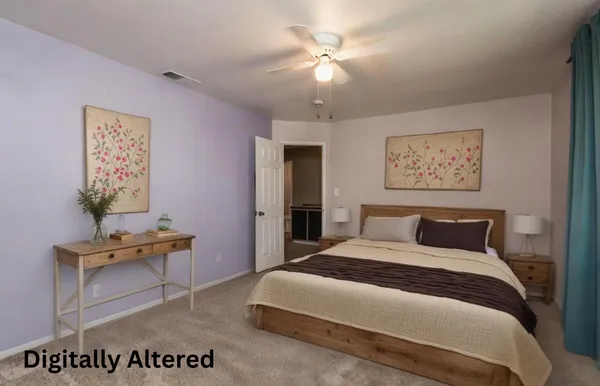 a bedroom with a bed and a table in it
