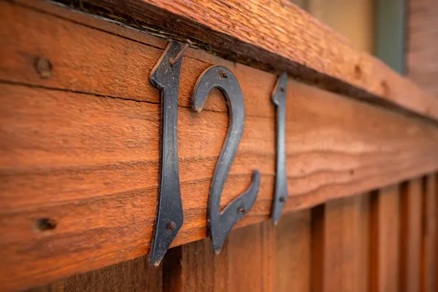an empty room with closet and windows