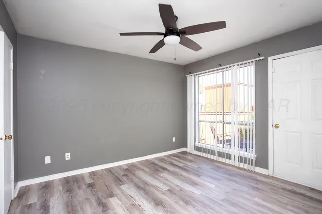 a view of an empty room and window