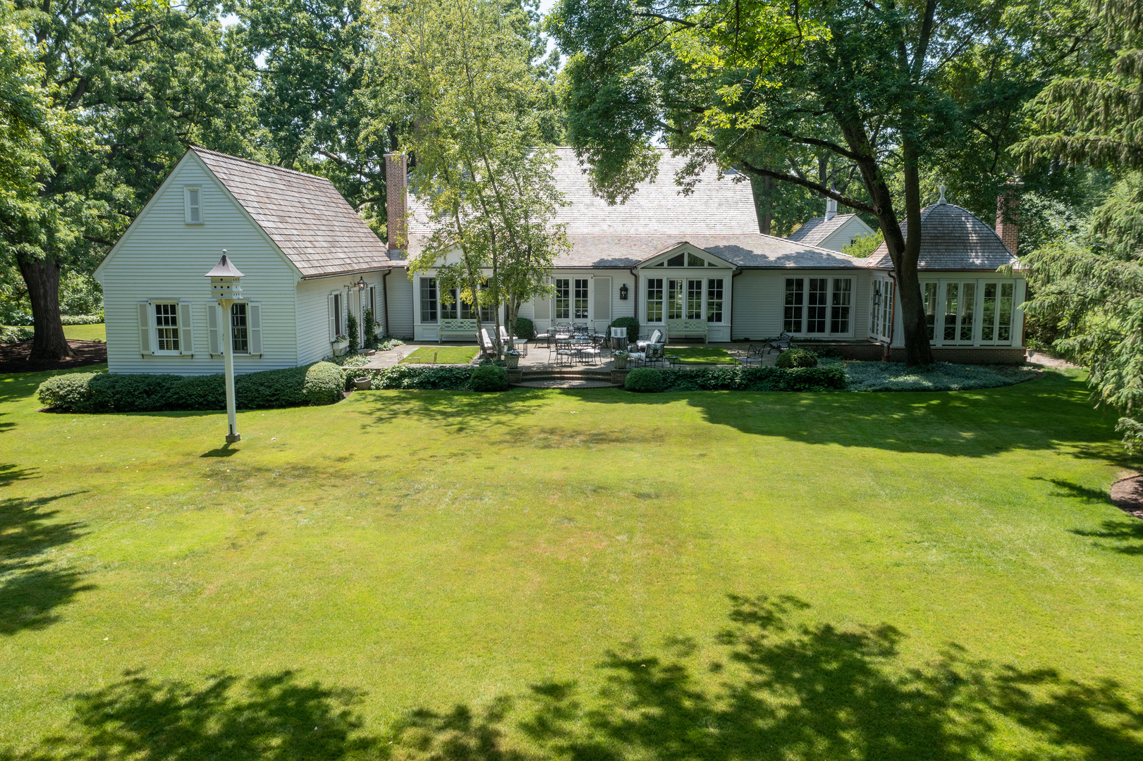 25 Indian Hill Road Winnetka, IL 60093 - Photo 3 of 84 a view of a house with swimming pool and sitting area