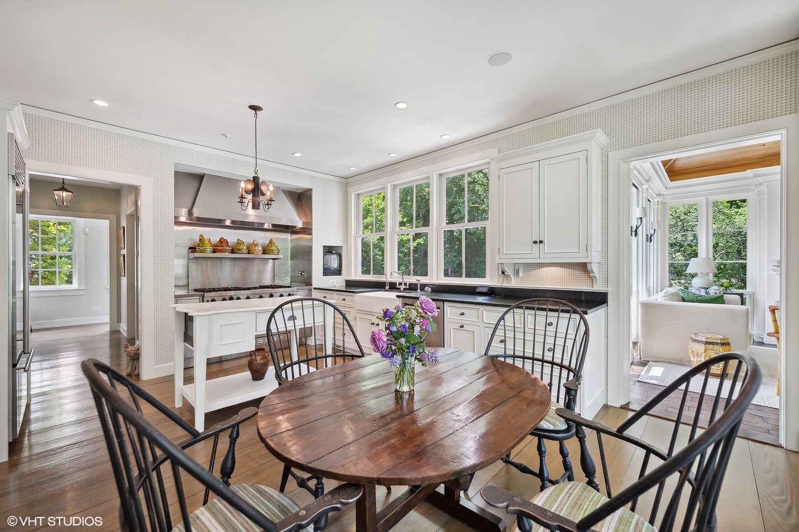 25 Indian Hill Road Winnetka, IL 60093 - Photo 34 of 84 a dining room with furniture a rug and wooden floor