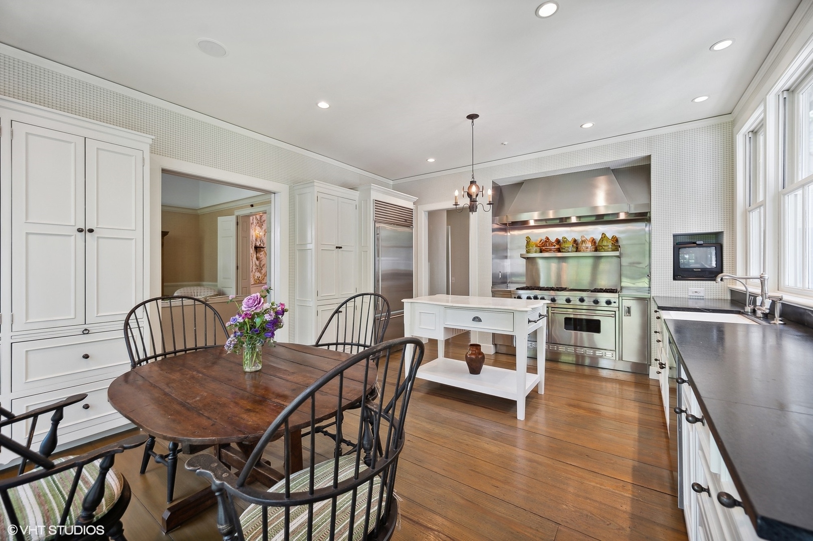 25 Indian Hill Road Winnetka, IL 60093 - Photo 35 of 84 a view of a dining room with furniture window and wooden floor