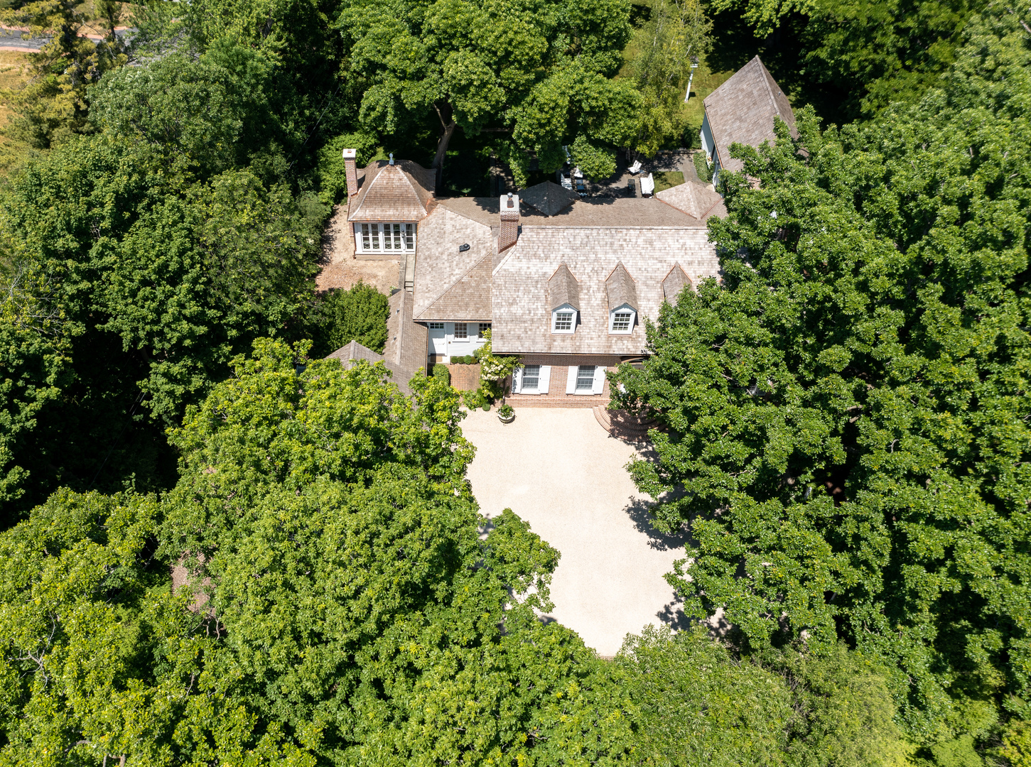 25 Indian Hill Road Winnetka, IL 60093 - Photo 4 of 84 an aerial view of a house with a yard and lake view