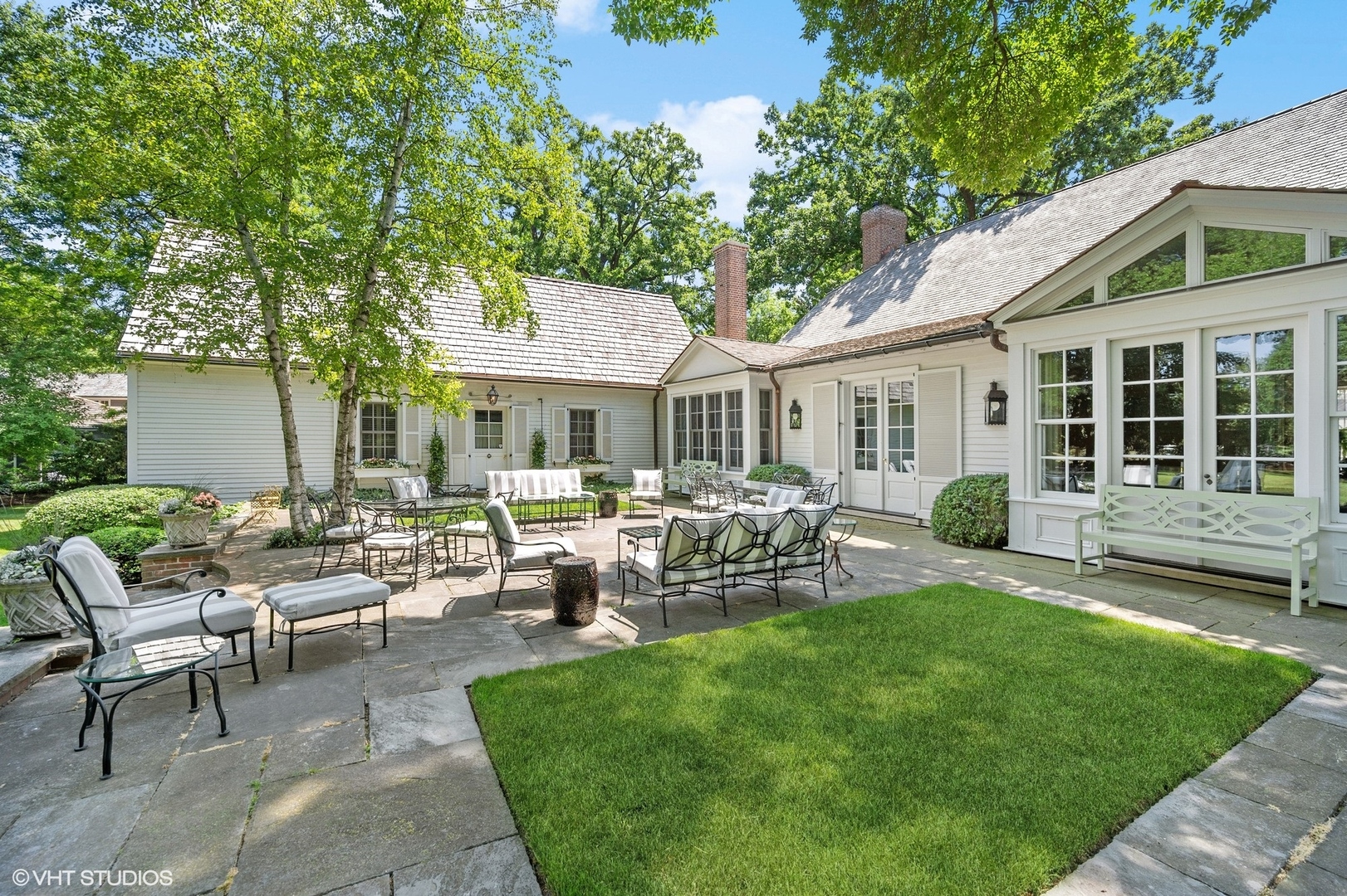 25 Indian Hill Road Winnetka, IL 60093 - Photo 49 of 84 a view of a house with backyard sitting area and garden