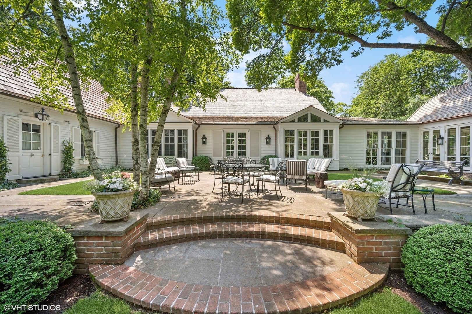 25 Indian Hill Road Winnetka, IL 60093 - Photo 50 of 84 a view of a house with swimming pool and sitting area