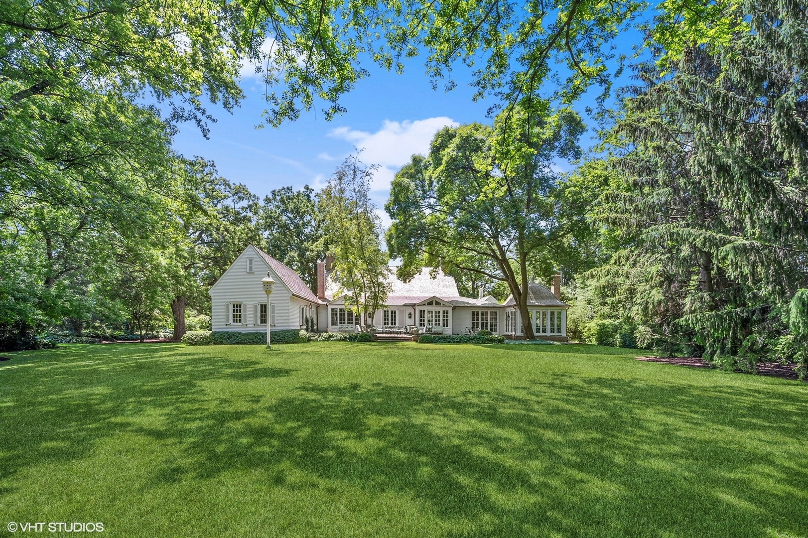 25 Indian Hill Road Winnetka, IL 60093 - Photo 5 of 84 a view of a tree in front of a house on a big yard
