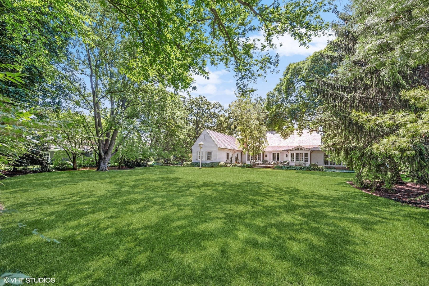 25 Indian Hill Road Winnetka, IL 60093 - Photo 58 of 84 a view of a big yard with plants and large trees