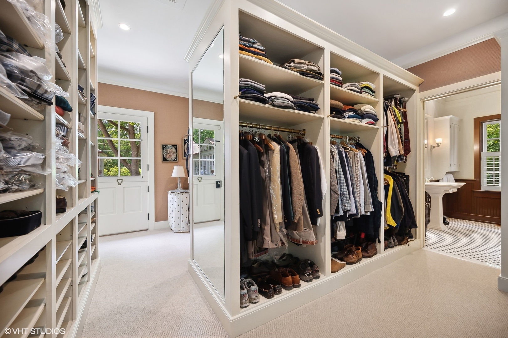 25 Indian Hill Road Winnetka, IL 60093 - Photo 64 of 84 a view of walk in closet with clothes and shoes