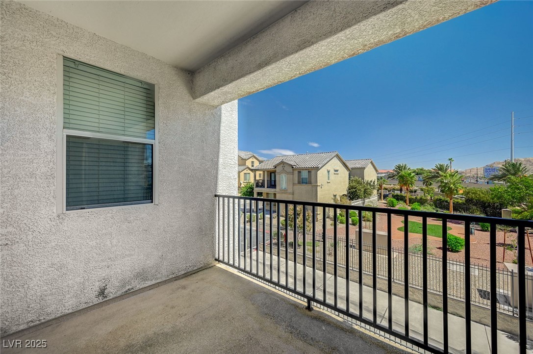 4437 Dover Straight Street, Unit 208 Las Vegas, NV 89115 - Photo 30 of 33 Balcony with a residential view