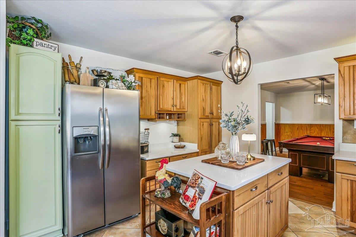 9481 Bridlewood Road Pensacola, FL 32526 - Photo 14 of 45 a kitchen with stainless steel appliances a stove a refrigerator and a dining table