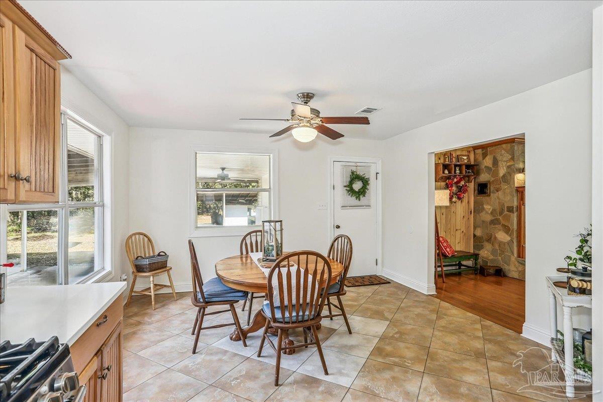9481 Bridlewood Road Pensacola, FL 32526 - Photo 17 of 45 a dining room with furniture and window
