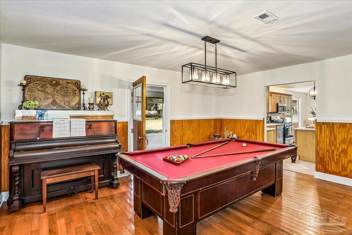 9481 Bridlewood Road Pensacola, FL 32526 - Photo 19 of 45 a room with pool table and wooden floor