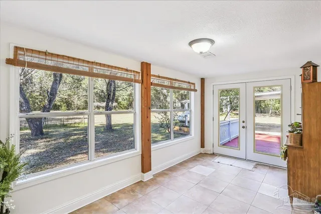 a view of an empty room and window