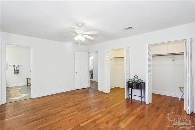 a view of livingroom with hardwood floor and a ceiling fan