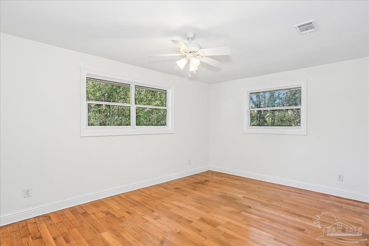 9481 Bridlewood Road Pensacola, FL 32526 - Photo 30 of 45 a view of a room with wooden floor and window