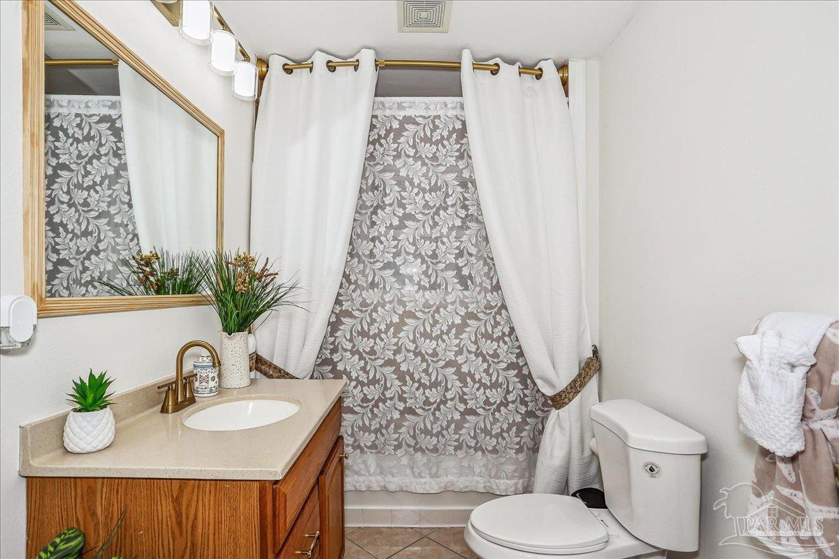 9481 Bridlewood Road Pensacola, FL 32526 - Photo 33 of 45 a bathroom with a sink toilet and shower
