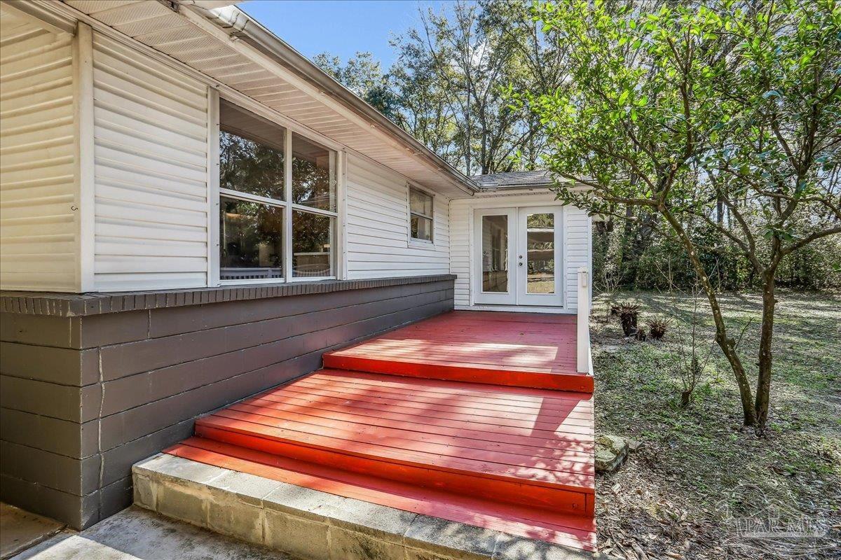 9481 Bridlewood Road Pensacola, FL 32526 - Photo 34 of 45 a backyard of a house with seating space