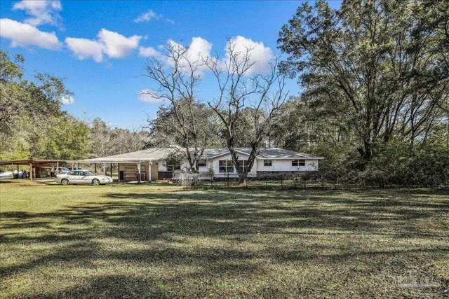 a swimming pool view with a outdoor seating