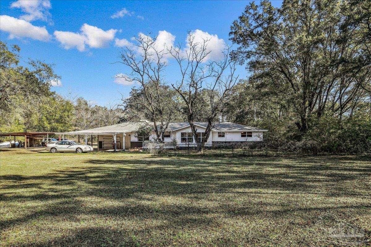 9481 Bridlewood Road Pensacola, FL 32526 - Photo 36 of 45 a swimming pool view with a outdoor seating
