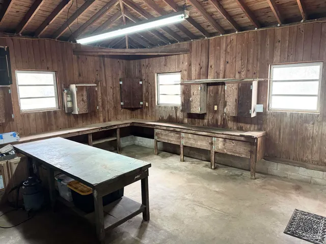 a kitchen with a table chairs and a sink