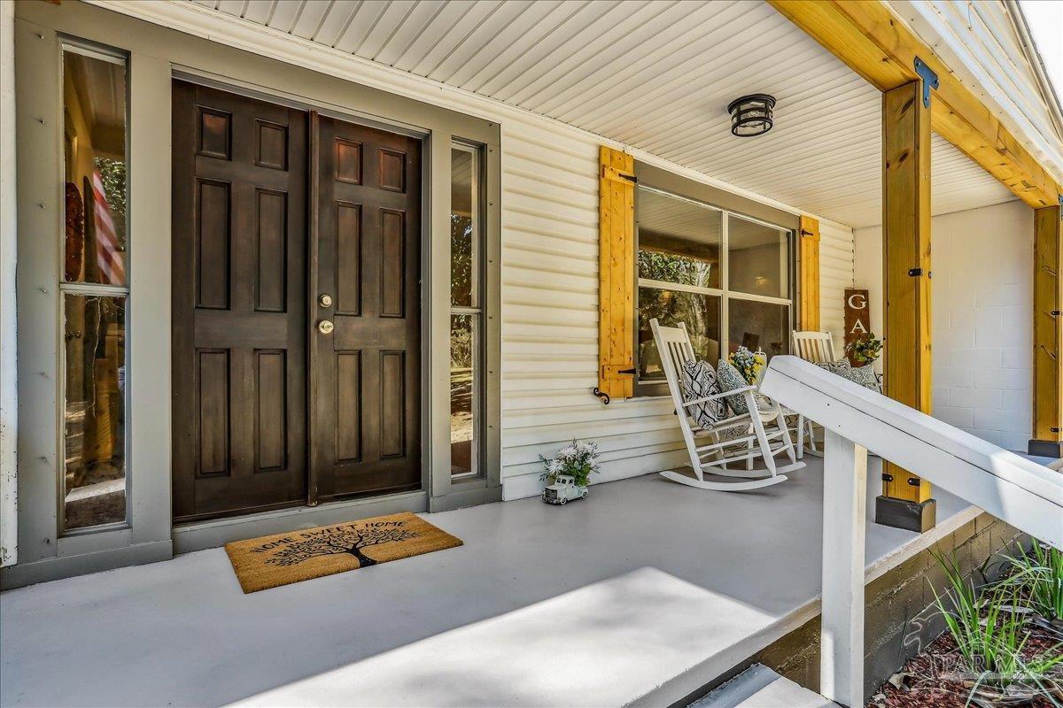 9481 Bridlewood Road Pensacola, FL 32526 - Photo 4 of 45 a view of backyard with furniture and outdoor seating