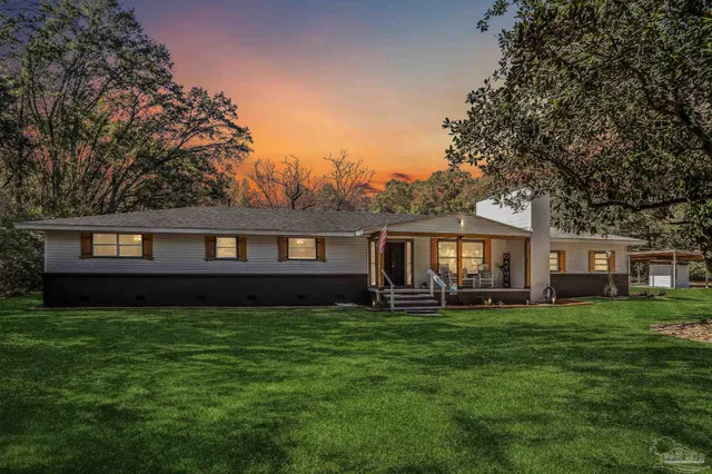 a view of a yard with a bench