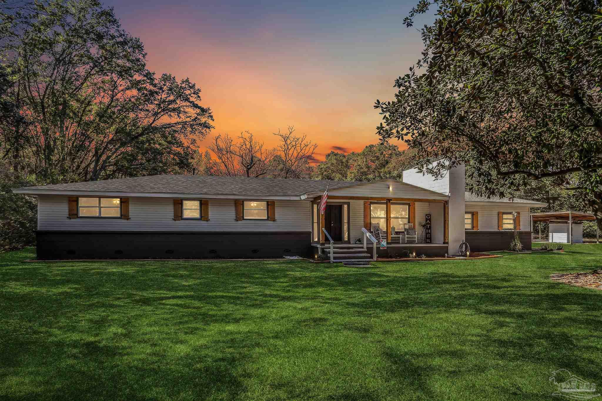 9481 Bridlewood Road Pensacola, FL 32526 - Photo 42 of 45 a front view of a house with a yard