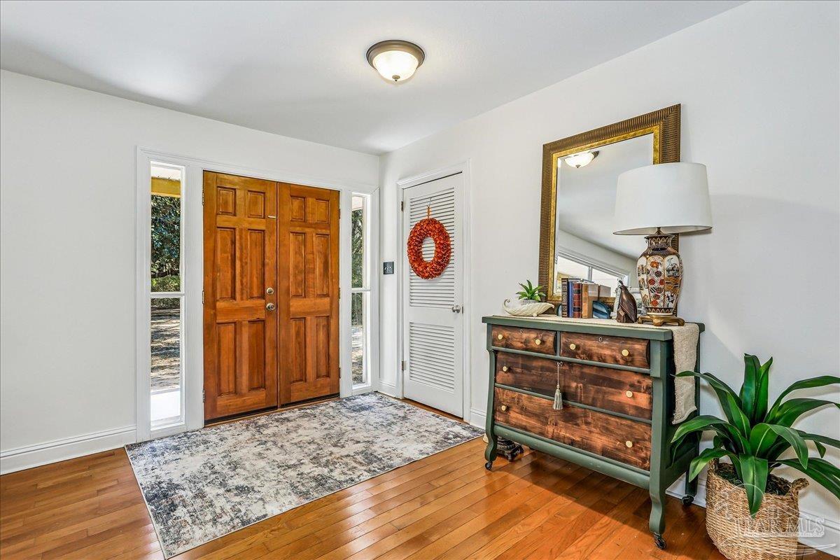 9481 Bridlewood Road Pensacola, FL 32526 - Photo 6 of 45 a view of an entryway with wooden floor