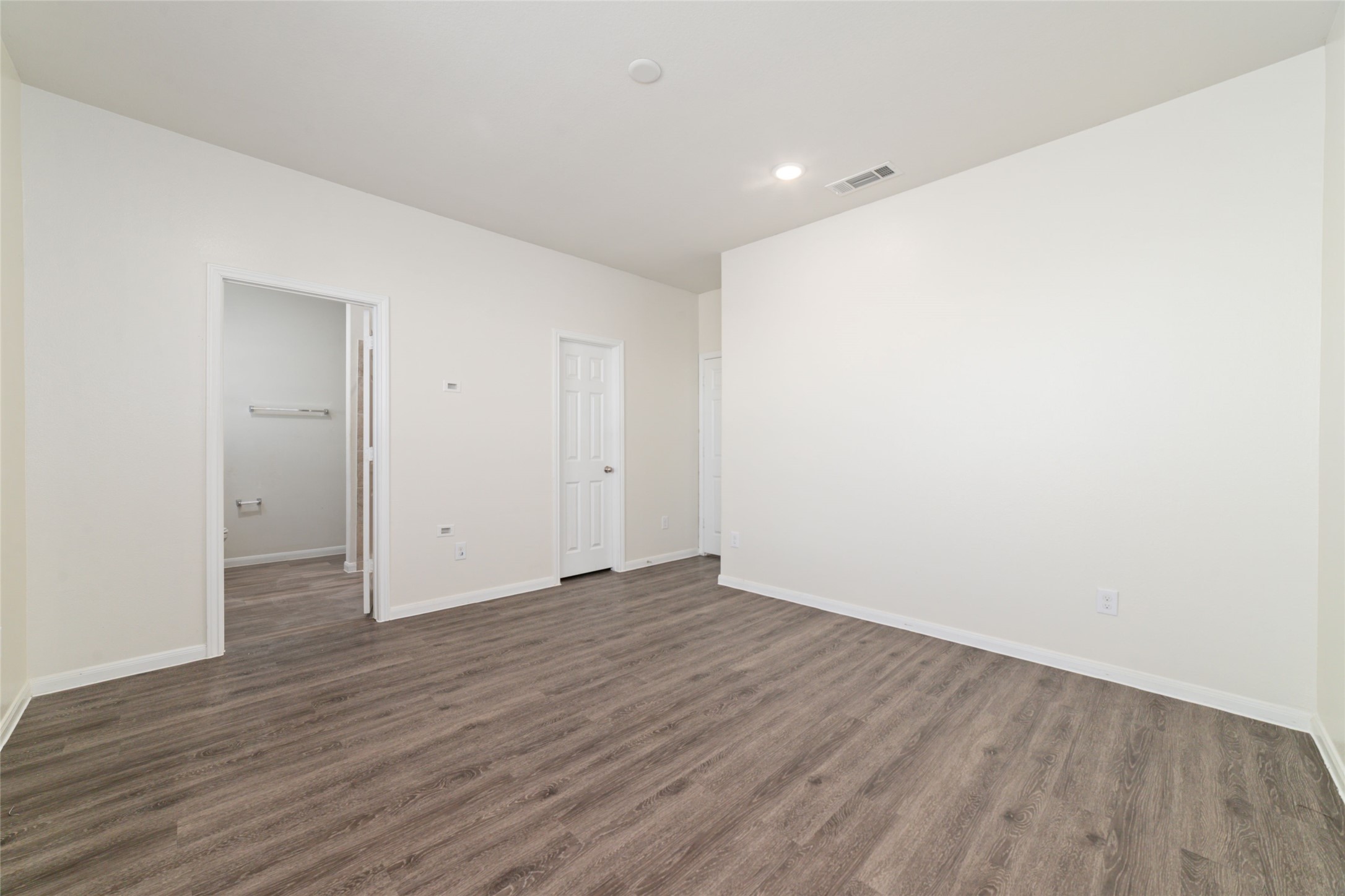 7227 Hobby Wind Ridge Drive Houston, TX 77075 - Photo 23 of 25 a view of an empty room with wooden floor