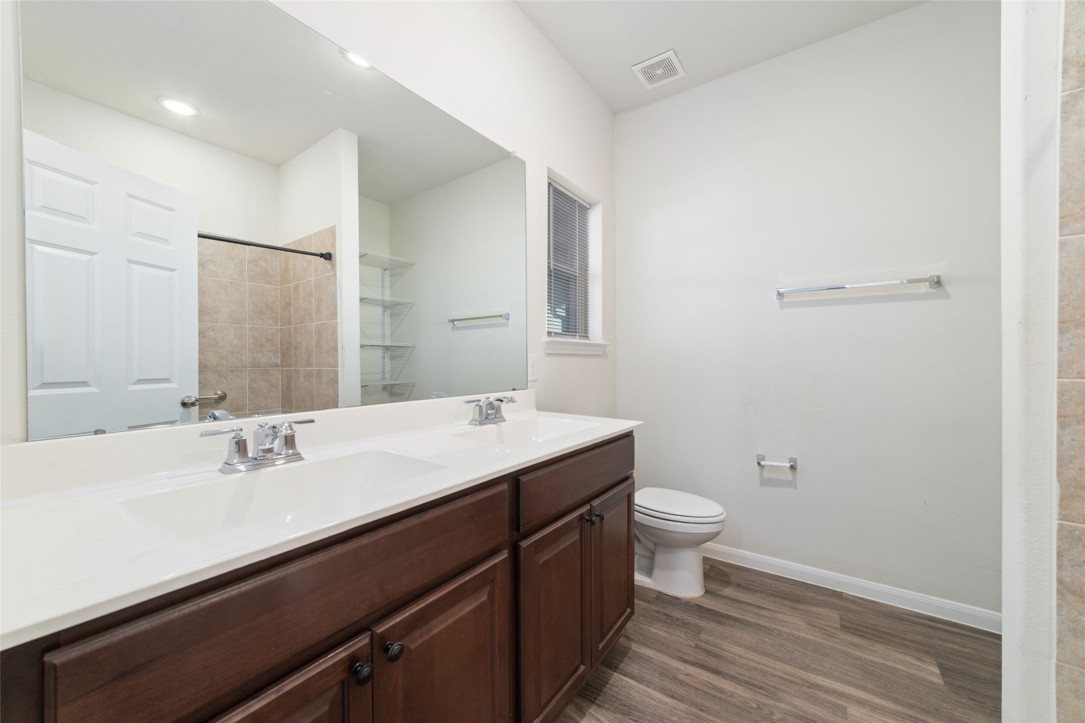 7227 Hobby Wind Ridge Drive Houston, TX 77075 - Photo 24 of 25 a bathroom with a sink a toilet a and mirror