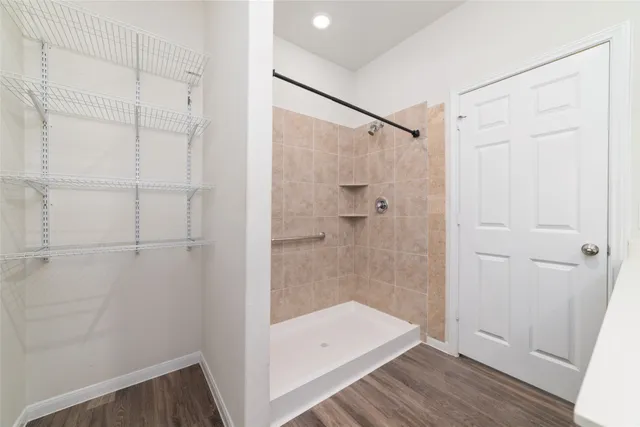 a bathroom with a shower and a sink
