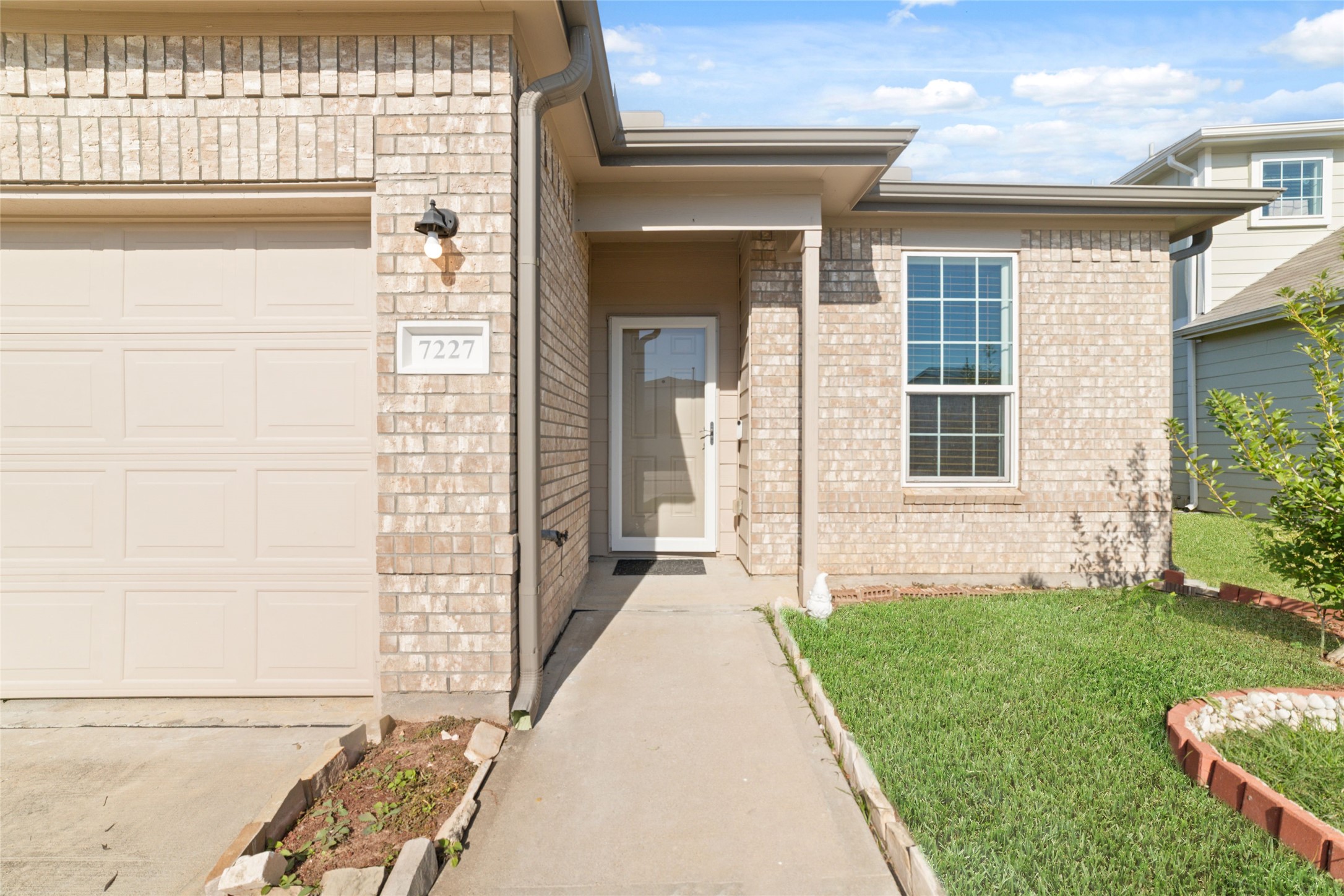 7227 Hobby Wind Ridge Drive Houston, TX 77075 - Photo 3 of 25 a front view of a house with a yard