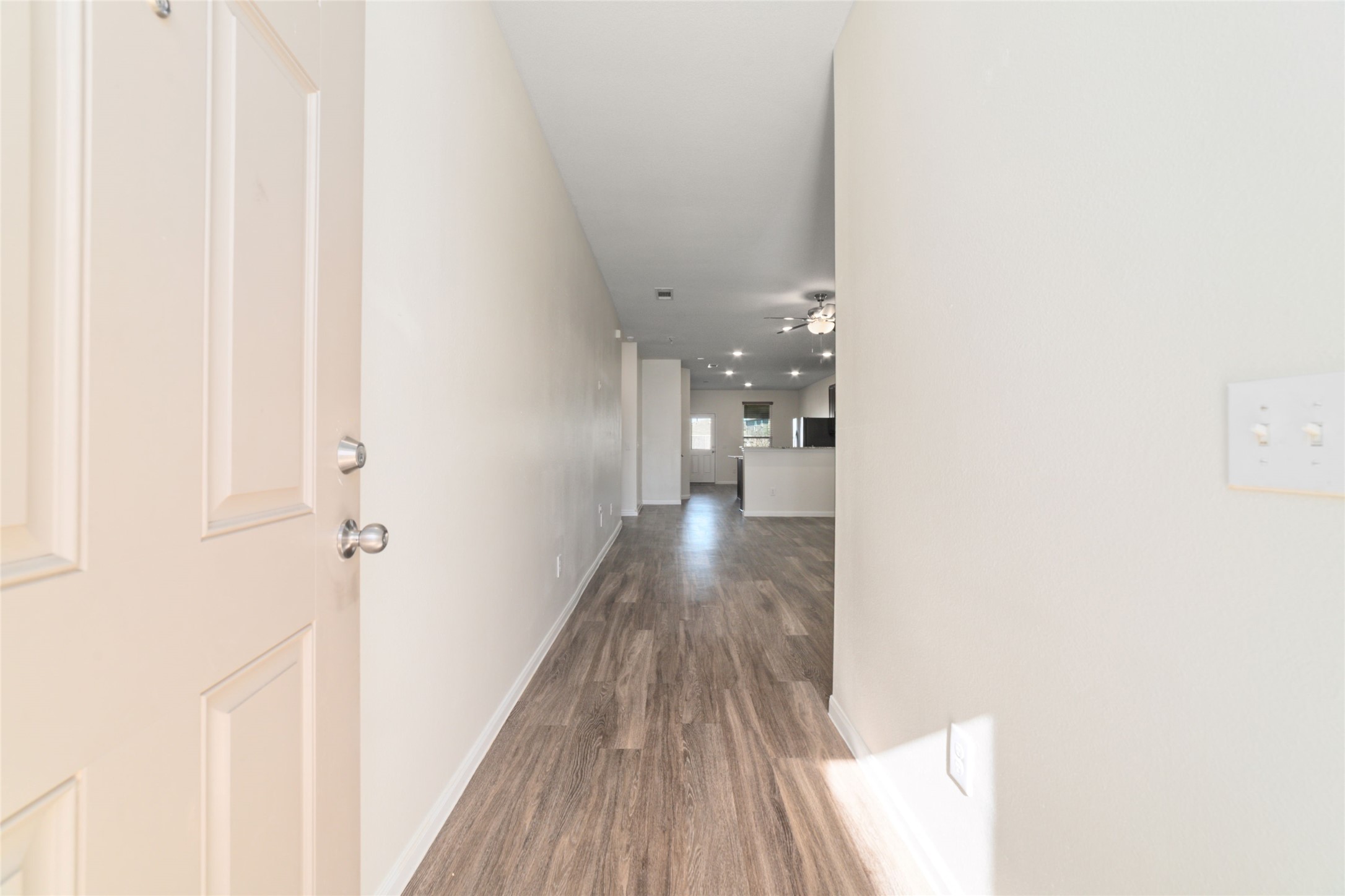 7227 Hobby Wind Ridge Drive Houston, TX 77075 - Photo 7 of 25 a view of a hallway with wooden floor