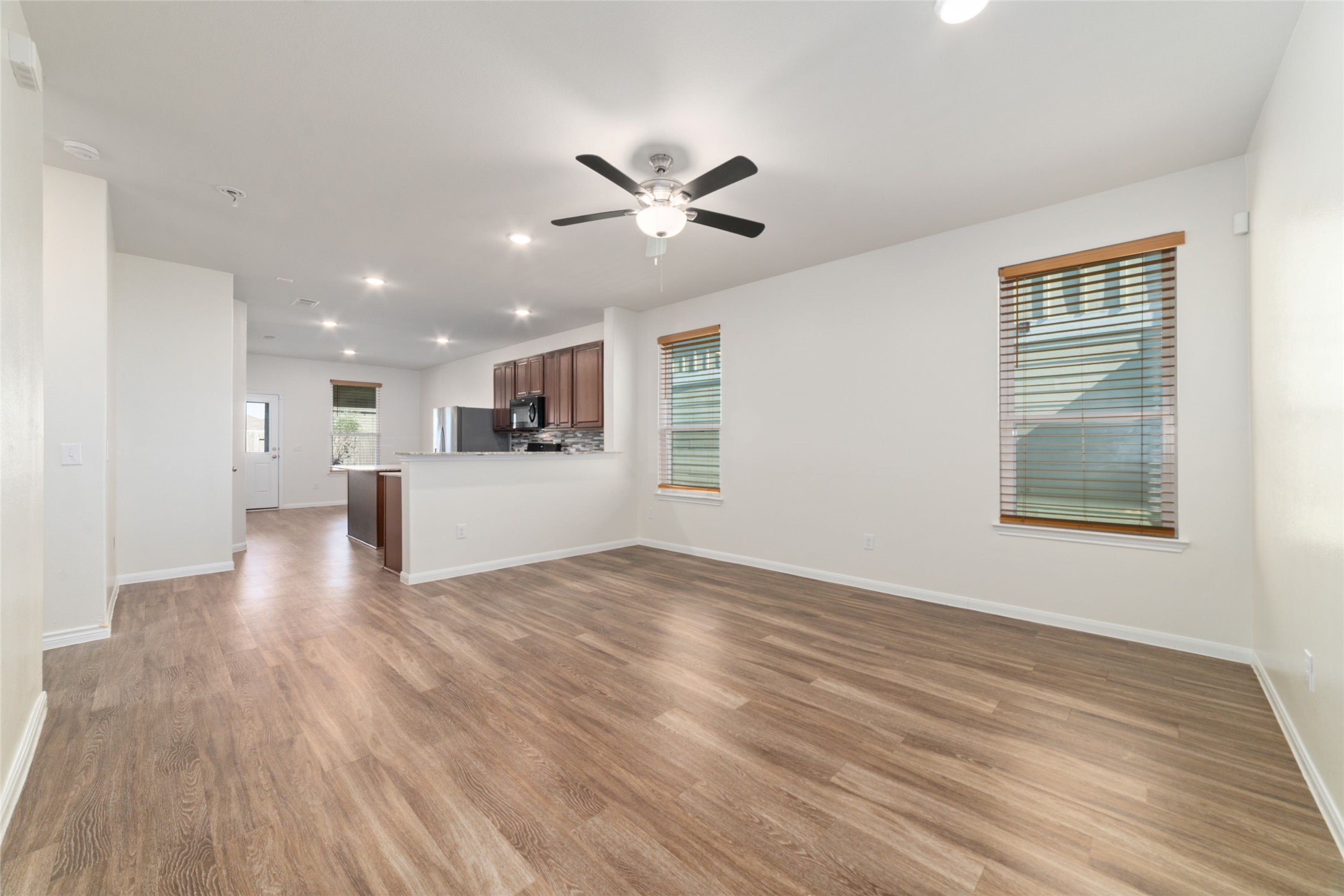 7227 Hobby Wind Ridge Drive Houston, TX 77075 - Photo 8 of 25 a view of an empty room with wooden floor and a window
