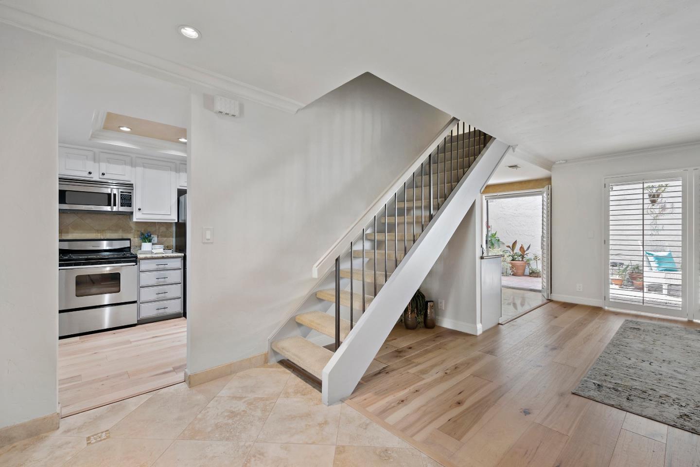 1213 Capri Drive Campbell, CA 95008 - Photo 11 of 27 a view of entryway and kitchen with wooden floor