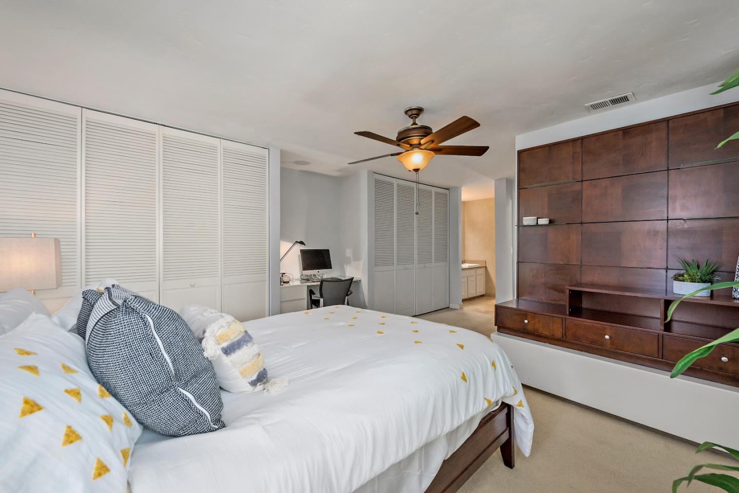 1213 Capri Drive Campbell, CA 95008 - Photo 16 of 27 a bedroom with a bed and a chandelier