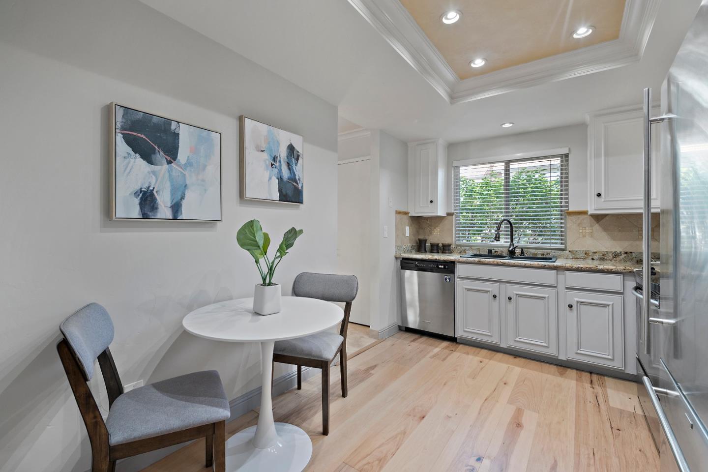1213 Capri Drive Campbell, CA 95008 - Photo 9 of 27 a kitchen with a table chairs sink and cabinets