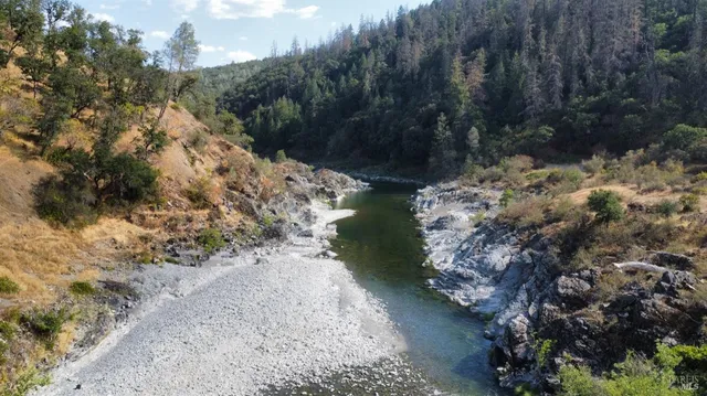 a view of a pathway with a lake view